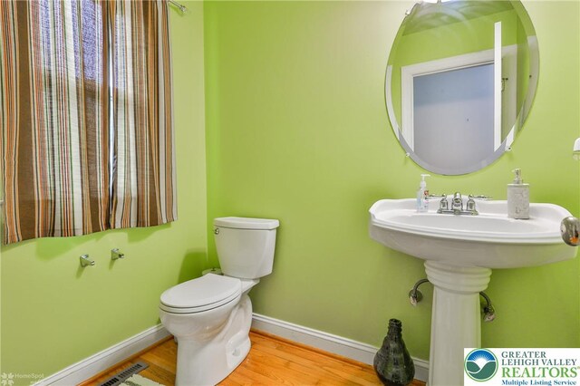 205 Maple Ct, Alburtis Boro, PA 18011 - half bathroom featuring baseboards and wood finished floors
