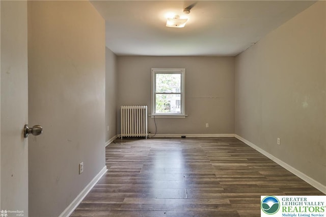 209 Cattell St, Easton, PA 18042 - spare room with radiator heating unit and dark wood finished floors