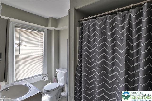 209 Cattell St, Easton, PA 18042 - bathroom with vanity, plenty of natural light, and a shower with curtain