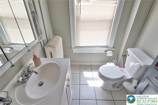 209 Cattell St, Easton, PA 18042 - bathroom featuring radiator heating unit, tile patterned flooring, vanity, and healthy amount of natural light