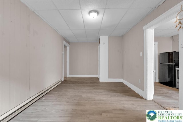 409 Broad St Unit 409, Tamaqua Boro, PA 18252 - empty room featuring baseboard heating, a paneled ceiling, and wood finished floors