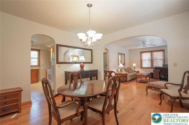 717 Claremont Ave, Schuylkill, PA 18252 - dining space featuring arched walkways, plenty of natural light, ceiling fan, and light wood-style floors