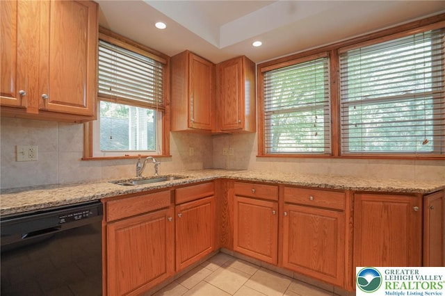 717 Claremont Ave, Schuylkill, PA 18252 - kitchen with black dishwasher, light stone counters, backsplash, light tile patterned floors, and recessed lighting
