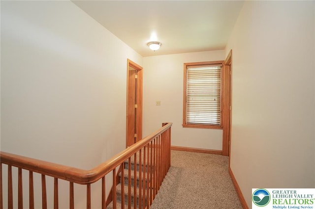 717 Claremont Ave, Schuylkill, PA 18252 - hallway with light carpet and an upstairs landing
