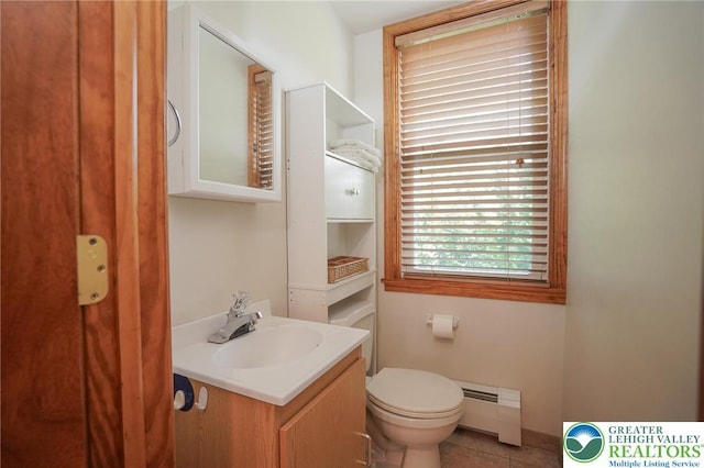 717 Claremont Ave, Schuylkill, PA 18252 - bathroom featuring a baseboard radiator, vanity, and tile patterned flooring
