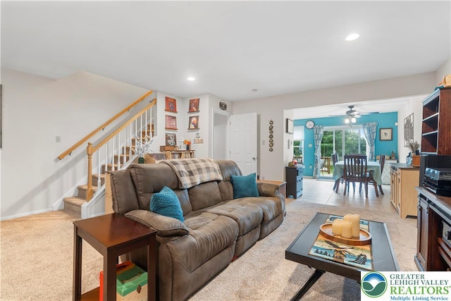 8067 Heritage Dr, Lower Macungie Twp, PA 18011 - living room with light colored carpet, stairway, recessed lighting, and ceiling fan