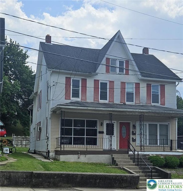 455 W Church St, Slatington Boro, PA 18080 - view of front of house with a chimney, covered porch, and a shingled roof