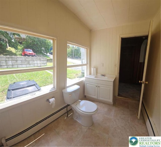 455 W Church St, Slatington Boro, PA 18080 - bathroom featuring a baseboard heating unit, vaulted ceiling, vanity, and tile patterned flooring