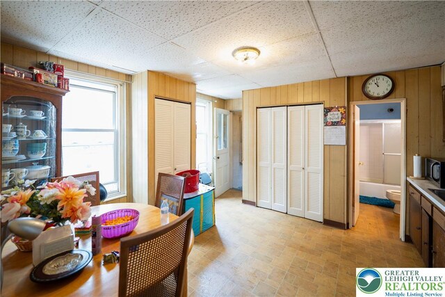 638 N 16th St, Allentown City, PA 18102 - dining room with wooden walls and a drop ceiling