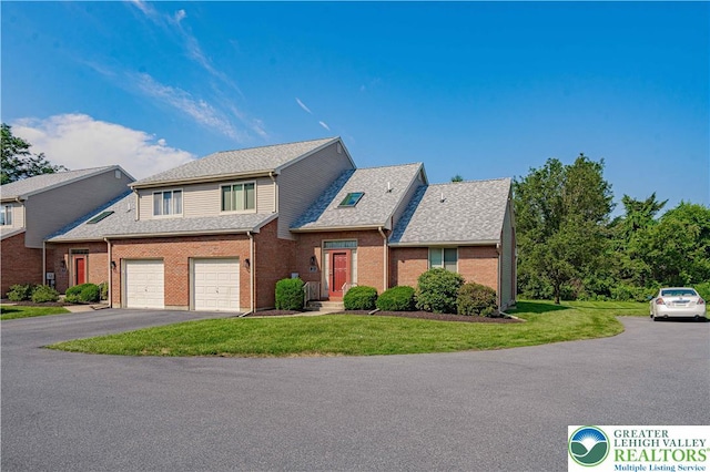 21 Winfield Ct, Easton, PA 18045 - traditional-style home featuring driveway, a front yard, brick siding, a shingled roof, and an attached garage