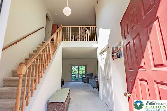 21 Winfield Ct, Easton, PA 18045 - foyer entrance with carpet flooring, a high ceiling, and stairway
