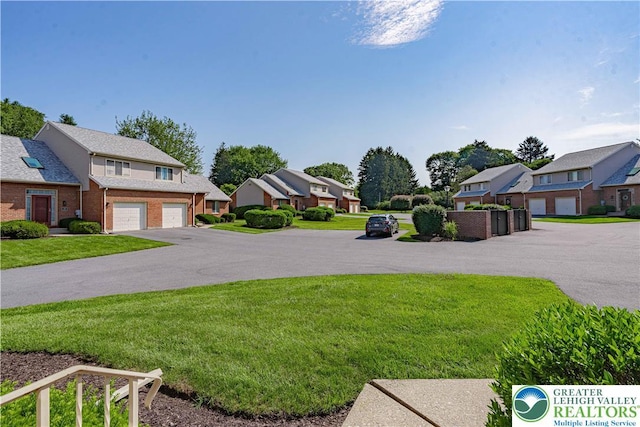 21 Winfield Ct, Easton, PA 18045 - view of grassy yard featuring a residential view and a garage