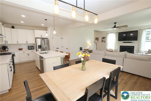 330 Bendelow Ln, Northampton Boro, PA 18067 - dining area featuring a ceiling fan, light wood-style floors, a fireplace, and recessed lighting