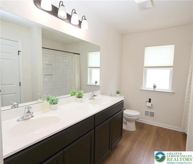 330 Bendelow Ln, Northampton Boro, PA 18067 - full bath featuring wood finished floors, double vanity, and a shower with shower curtain