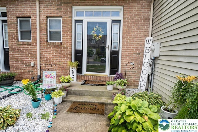 104 Stephanie Dr, Palmer Twp, PA 18045 - doorway to property featuring brick siding