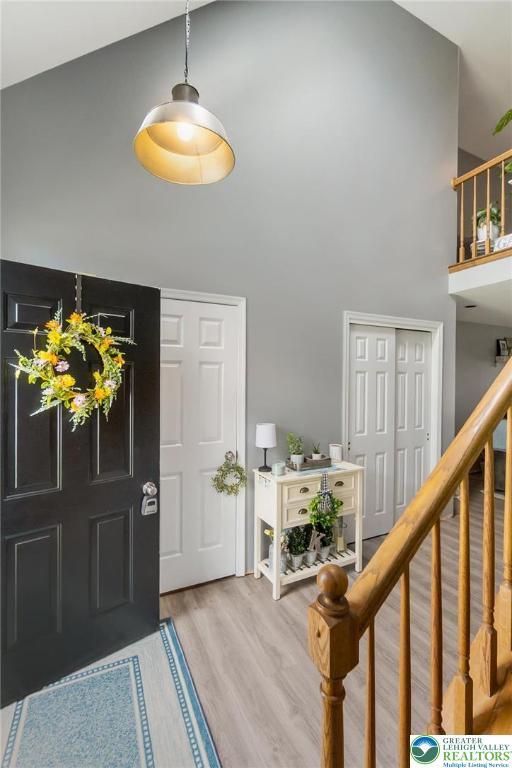 104 Stephanie Dr, Palmer Twp, PA 18045 - entrance foyer with a high ceiling, wood finished floors, and stairway