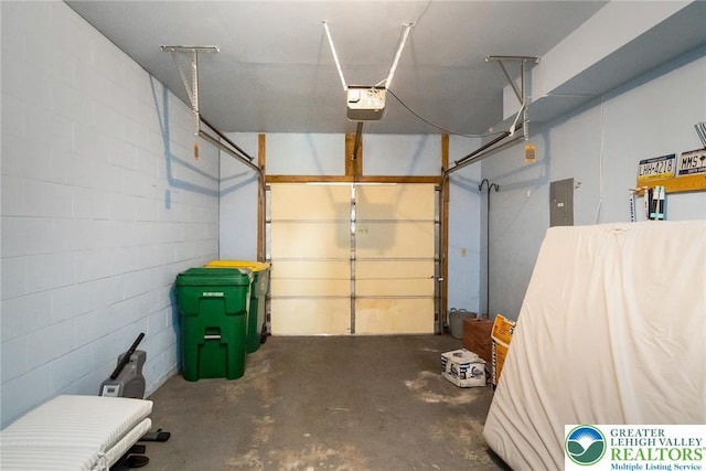 104 Stephanie Dr, Palmer Twp, PA 18045 - garage with a garage door opener, concrete block wall, and electric panel