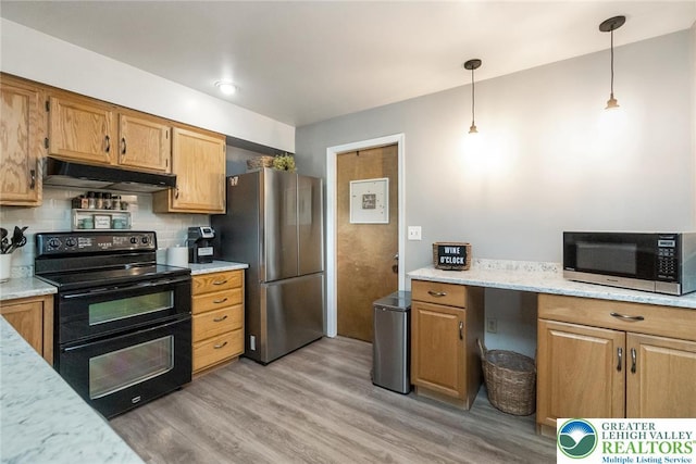 104 Stephanie Dr, Palmer Twp, PA 18045 - kitchen with appliances with stainless steel finishes, under cabinet range hood, light wood-style floors, pendant lighting, and tasteful backsplash