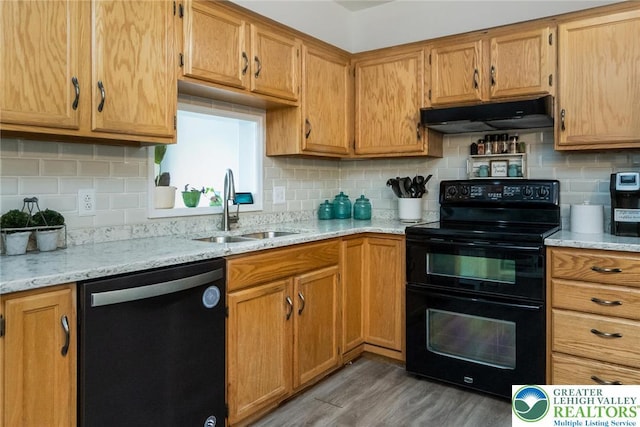 104 Stephanie Dr, Palmer Twp, PA 18045 - kitchen with black appliances, under cabinet range hood, and backsplash
