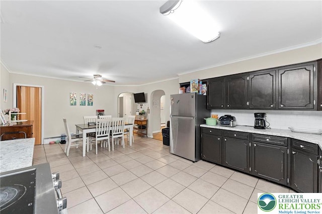 4116 Springmill Rd, Whitehall Twp, PA 18052 - kitchen featuring freestanding refrigerator, arched walkways, ceiling fan, light tile patterned floors, and light countertops