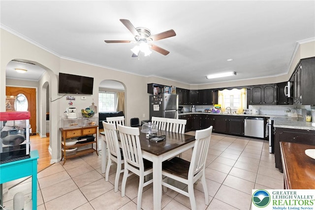 4116 Springmill Rd, Whitehall Twp, PA 18052 - dining area featuring arched walkways, ceiling fan, crown molding, and light tile patterned floors