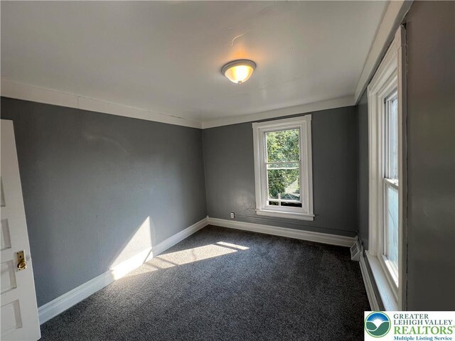 18 S Bradford St, Allentown City, PA 18109 - empty room with dark colored carpet and baseboards