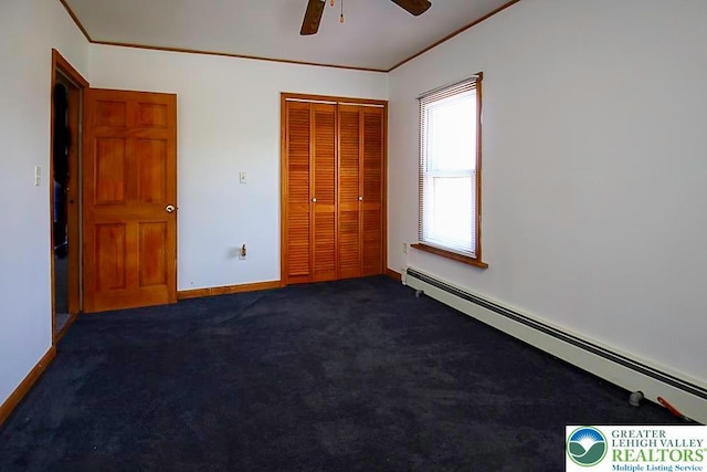 532 Broadway, Bangor Boro, PA 18013 - unfurnished bedroom with baseboard heating, ornamental molding, a closet, dark carpet, and ceiling fan
