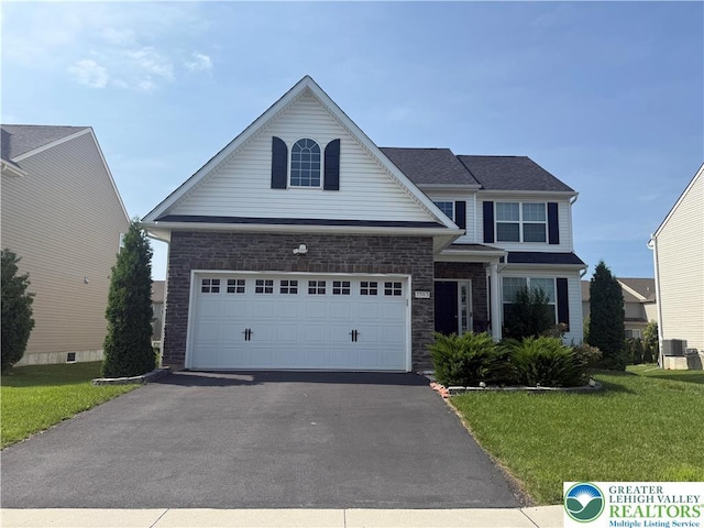 3563 Sweetgum Dr, Lower Nazareth Twp, PA 18064 - traditional-style home featuring driveway, a garage, and a front lawn