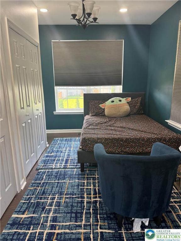 3563 Sweetgum Dr, Lower Nazareth Twp, PA 18064 - bedroom with baseboards and a chandelier