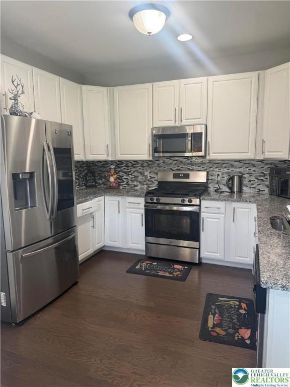 3563 Sweetgum Dr, Lower Nazareth Twp, PA 18064 - kitchen with stainless steel appliances, white cabinets, and tasteful backsplash