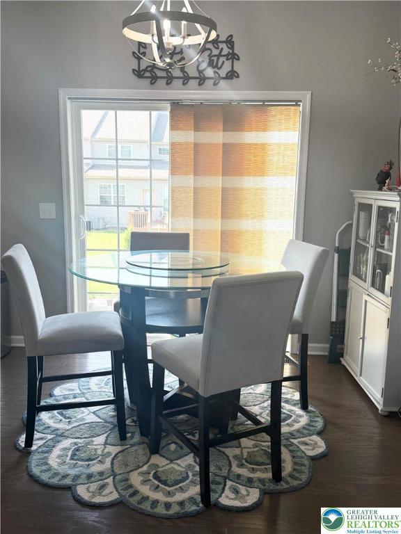 3563 Sweetgum Dr, Lower Nazareth Twp, PA 18064 - dining room featuring a chandelier and dark wood-style floors