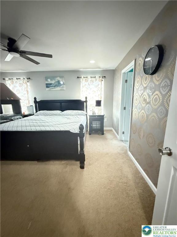 3563 Sweetgum Dr, Lower Nazareth Twp, PA 18064 - bedroom with light carpet and ceiling fan
