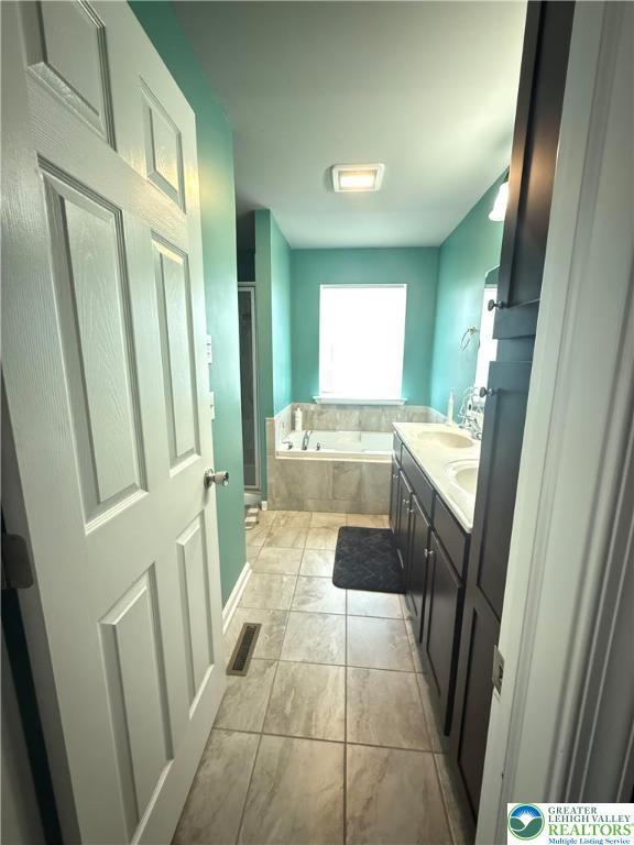 3563 Sweetgum Dr, Lower Nazareth Twp, PA 18064 - full bathroom featuring a garden tub and double vanity