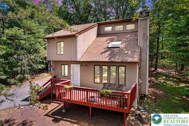 117 Manchester Dr, Lehman Twp, PA 18324 - view of front facade featuring a shingled roof and a deck