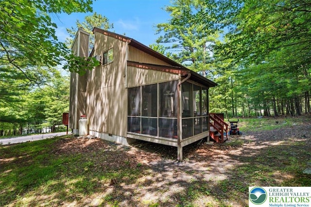 117 Manchester Dr, Lehman Twp, PA 18324 - view of side of property featuring a sunroom and crawl space