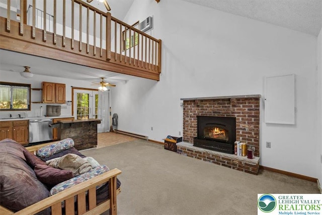 117 Manchester Dr, Lehman Twp, PA 18324 - living area featuring high vaulted ceiling, a baseboard heating unit, light carpet, a brick fireplace, and ceiling fan