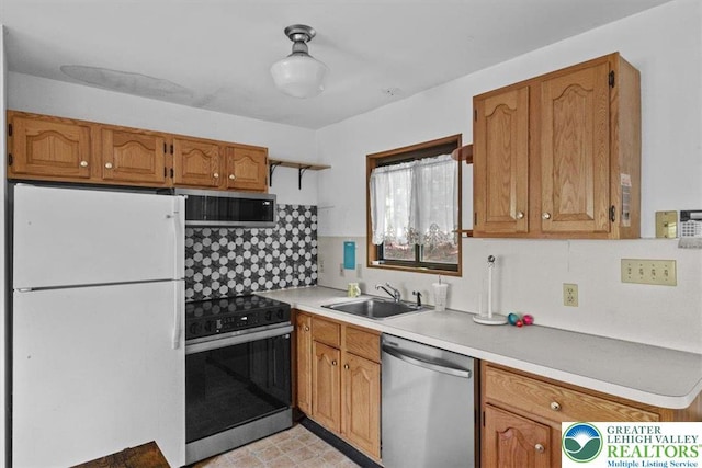 117 Manchester Dr, Lehman Twp, PA 18324 - kitchen featuring freestanding refrigerator, dishwasher, range with electric stovetop, tasteful backsplash, and light countertops