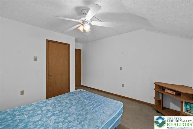 117 Manchester Dr, Lehman Twp, PA 18324 - carpeted bedroom featuring a textured ceiling and ceiling fan