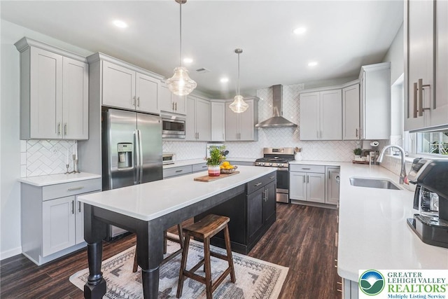 3334 Coventry Dr, Lower Macungie Twp, PA 18062 - kitchen with wall chimney range hood, stainless steel appliances, a kitchen island, backsplash, and dark wood-type flooring