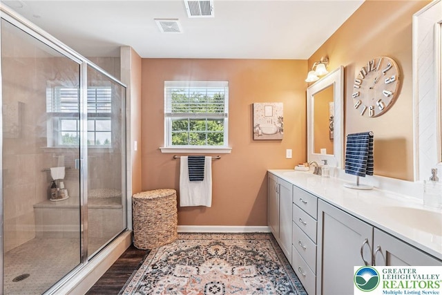 3334 Coventry Dr, Lower Macungie Twp, PA 18062 - full bath featuring double vanity, a stall shower, and wood finished floors