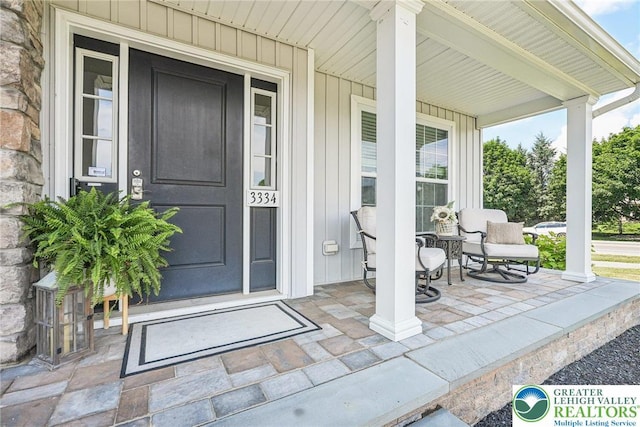 3334 Coventry Dr, Lower Macungie Twp, PA 18062 - property entrance featuring covered porch and board and batten siding