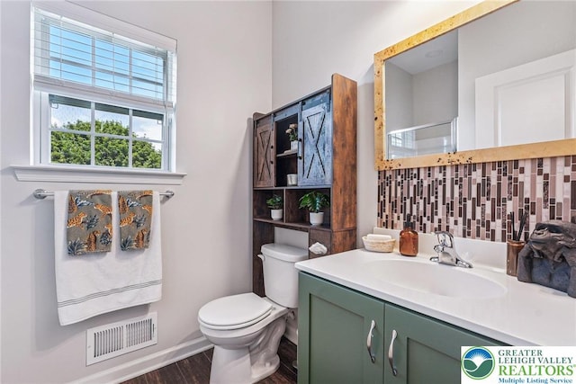 3334 Coventry Dr, Lower Macungie Twp, PA 18062 - bathroom featuring wood finished floors, vanity, decorative backsplash, and an enclosed shower