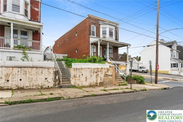 1002 S 6th St, Allentown City, PA 18103 - multi unit property with covered porch, stairway, and brick siding