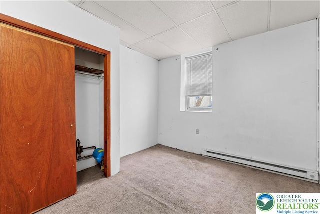 1002 S 6th St, Allentown City, PA 18103 - unfurnished bedroom featuring baseboard heating, carpet, a closet, and a paneled ceiling