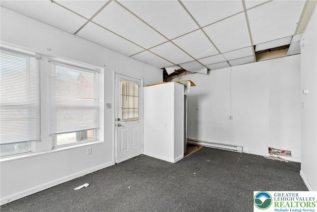 1002 S 6th St, Allentown City, PA 18103 - garage featuring a baseboard radiator and baseboards
