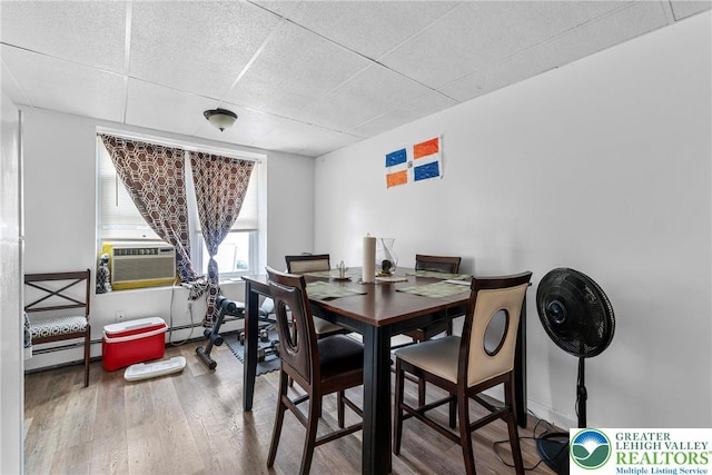 1002 S 6th St, Allentown City, PA 18103 - dining room featuring a drop ceiling, cooling unit, wood finished floors, and a baseboard heating unit