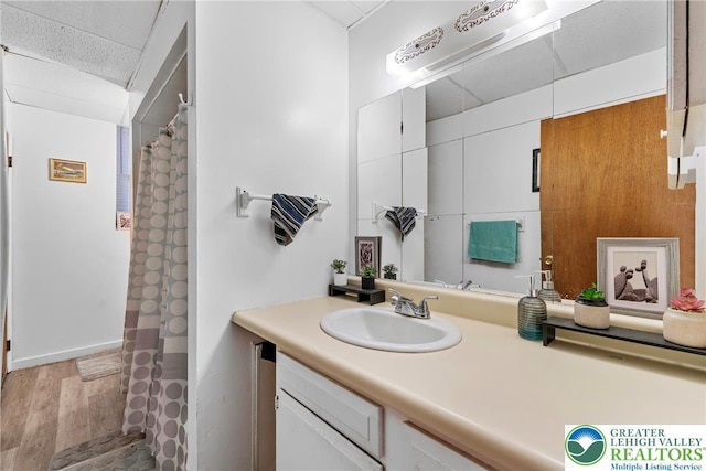 1002 S 6th St, Allentown City, PA 18103 - bathroom with vanity, wood finished floors, and a shower with shower curtain