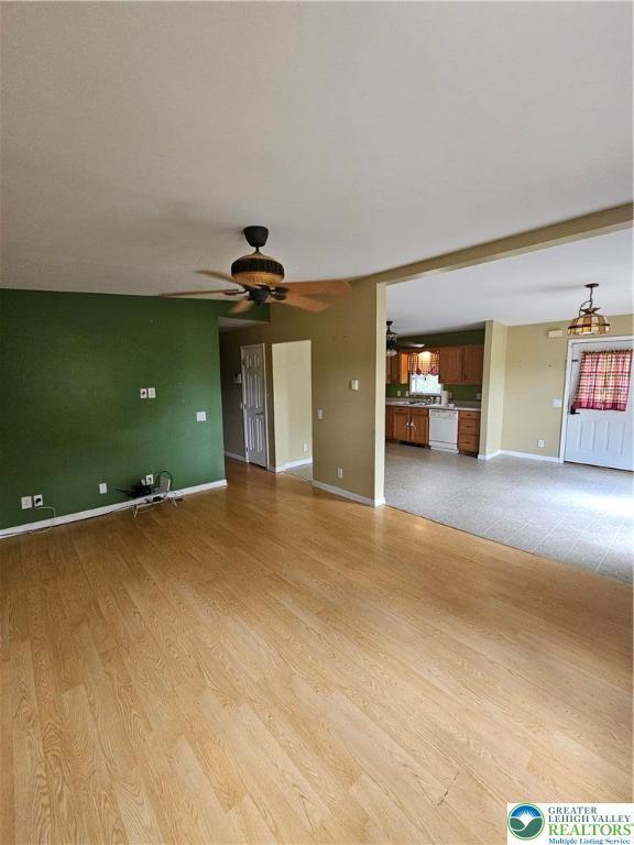 178 Sparrow Ln, Penn Forest Twp, PA 18229 - unfurnished living room featuring a ceiling fan and light wood-type flooring