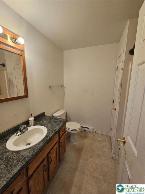 178 Sparrow Ln, Penn Forest Twp, PA 18229 - bathroom featuring vanity and a baseboard radiator