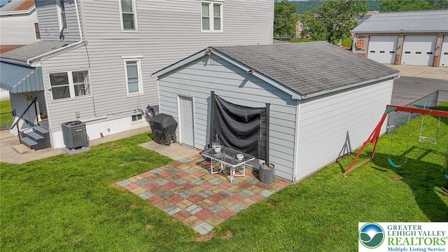 126 W High St, Coaldale Boro, PA 18218 - rear view of house with a shingled roof, an outbuilding, and a patio area